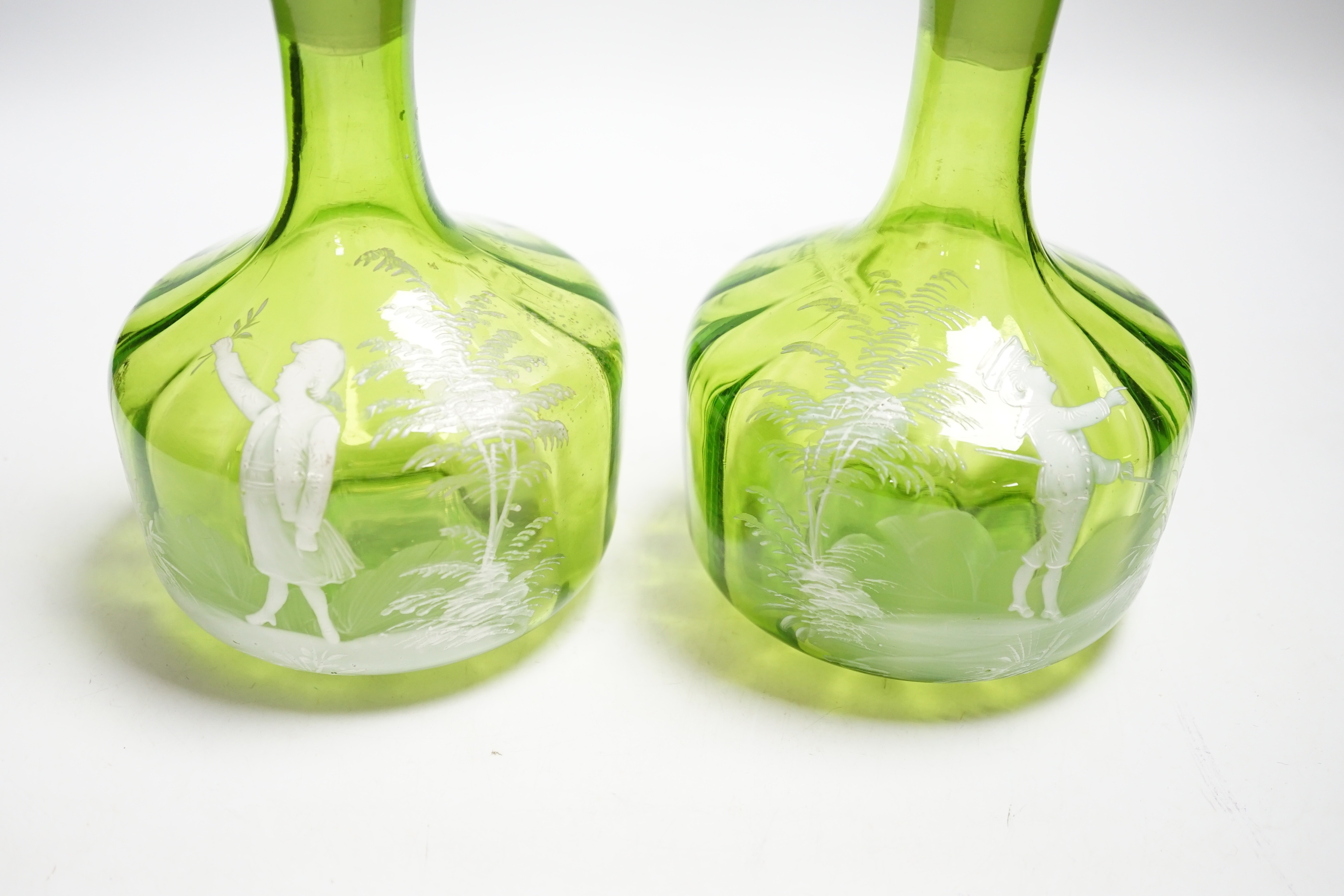 A pair of Mary Gregory glass decanters and stoppers, 26cm